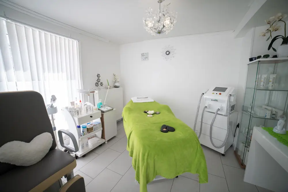 Bright treatment room with a bed and equipment